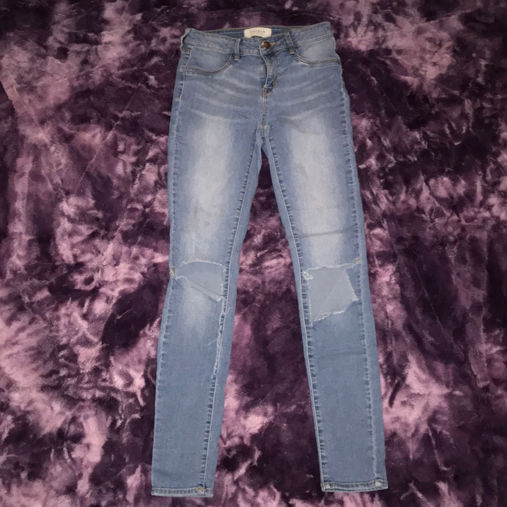 Light blue ripped skinny jeans.